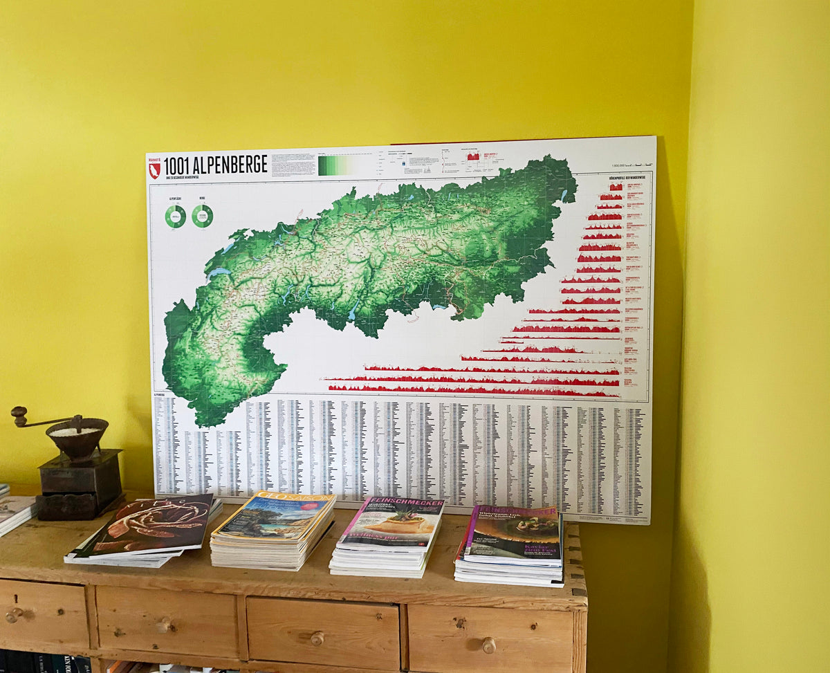 Map of the Alps with 1001 mountains – leaning against a yellow-green wall on a chest of drawers